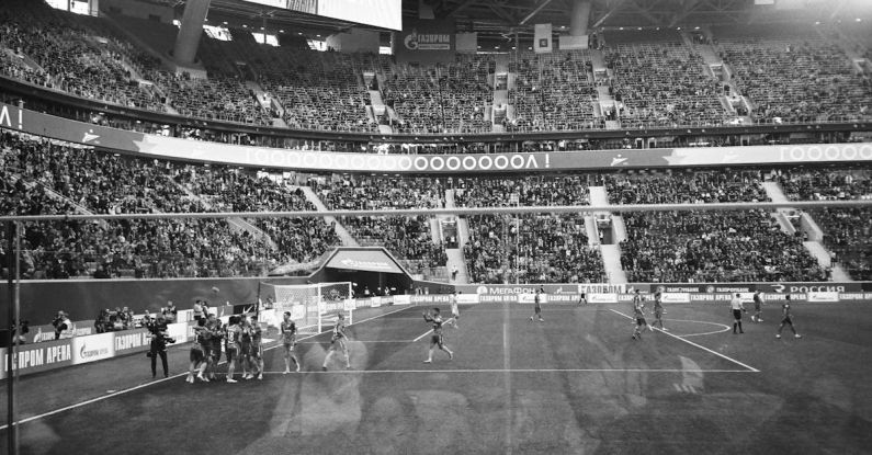 Community Sports - Stadium players celebrating goal during football match