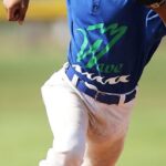 Youth Sports - Boy in Blue and White Baseball Jersey Running on Brown Soil Field during Daytime