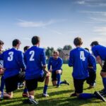 Professional Sports - Group of Sports Player Kneeling on Field