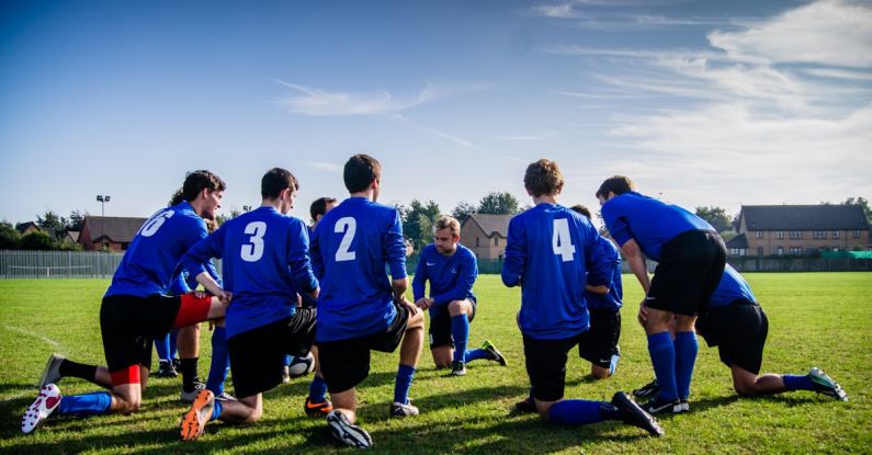 Professional Sports - Group of Sports Player Kneeling on Field