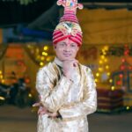 Traditional Festivals - A man in traditional clothing poses for a photo