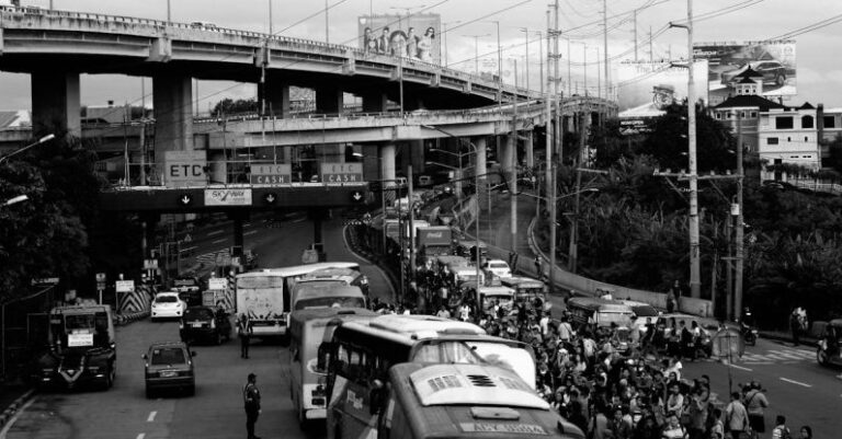 Electric Buses - Jammed Traffic in Gray Scale Photography