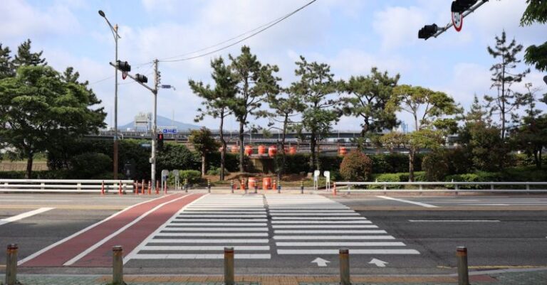 Walkability - Pedestrian Crossing in Partially Sun Shadow