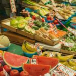 Local Economies - Colorful fruits and vegetables placed on counter in local market